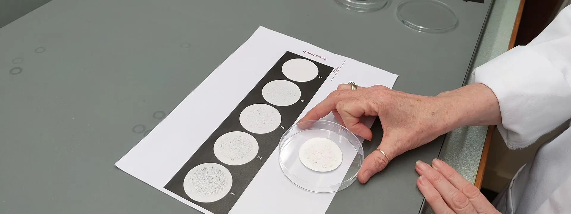 Image shows Dr Lisa Macintyre using the fibre fragmentation scale.