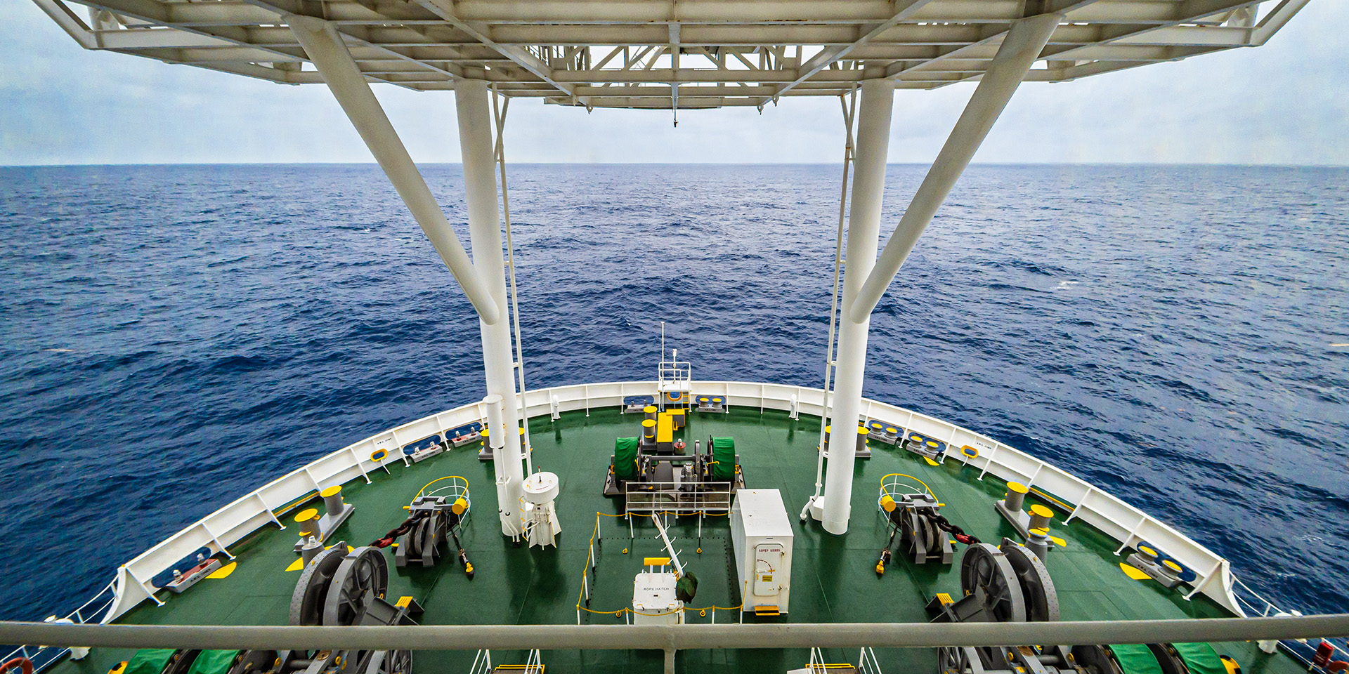 Looking down on deck at the prow of research vessel at sea
