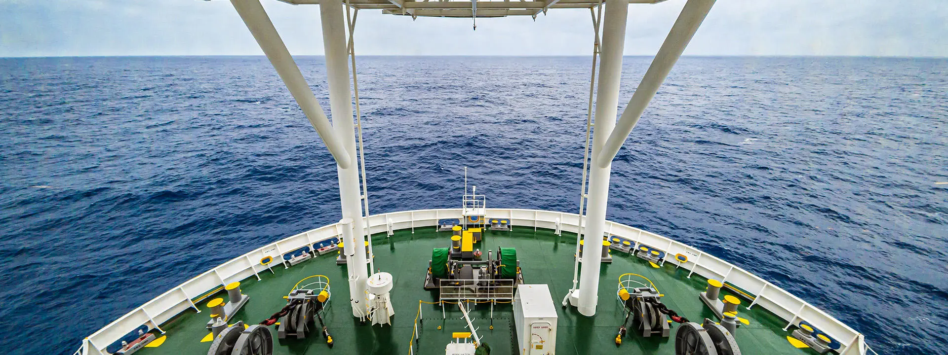 Looking down on deck at the prow of research vessel at sea