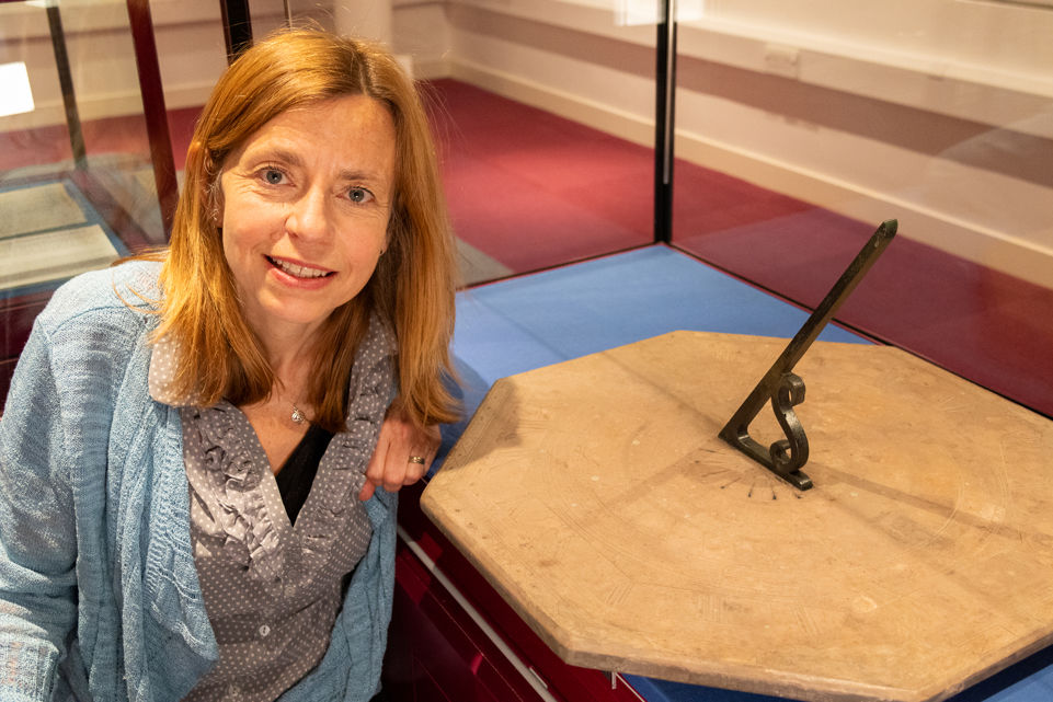 Heriot-Watt Curator Julia Stephen with the restored sundial. Curator Julia Stephen with the sundial