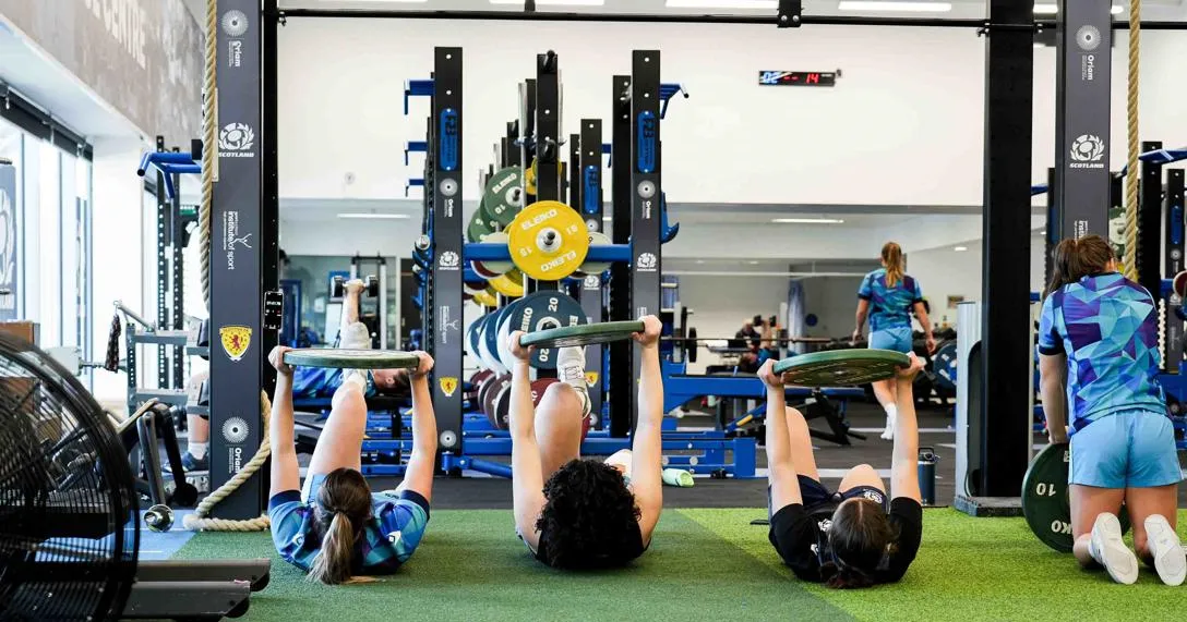 Women rugby players training in gym