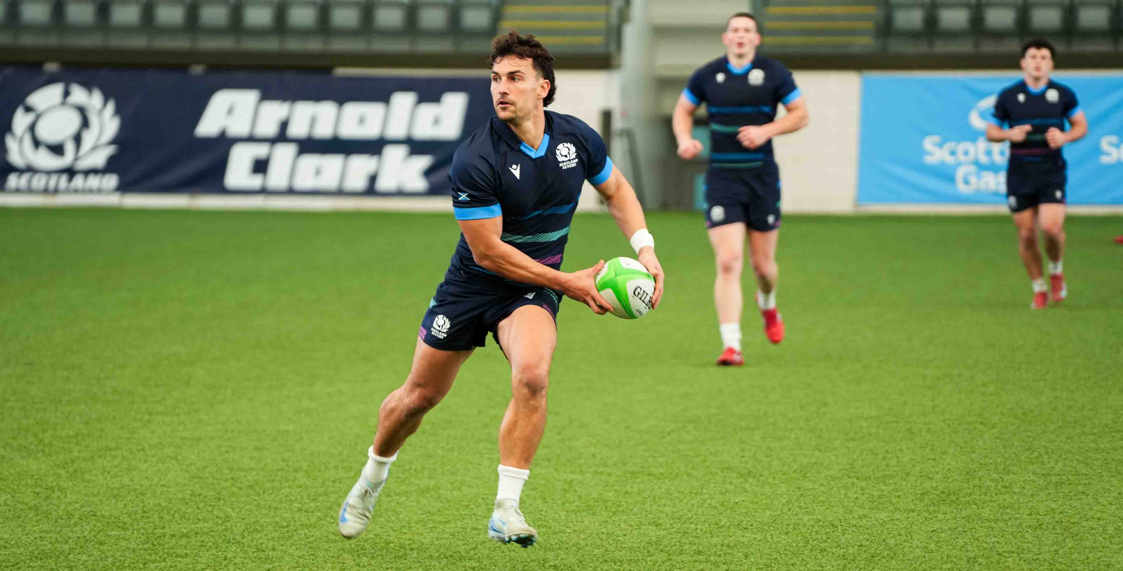 Rugby player in action about to release the ball