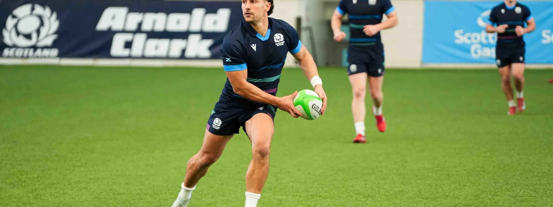 Rugby player in action about to release the ball