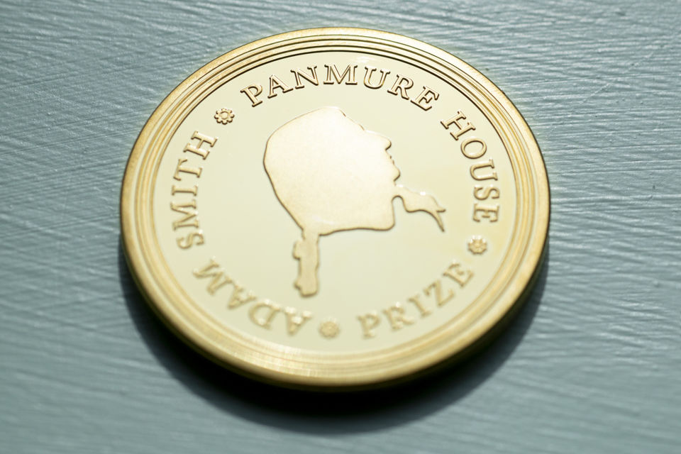 A symbolic gold-plated bronze coin with the profile of Adam Smith is presented to the winner of the Panmure House Prize. A symbolic gold-plated bronze coin with the profile of Adam Smith is presented to the winner of the Panmure House Prize.