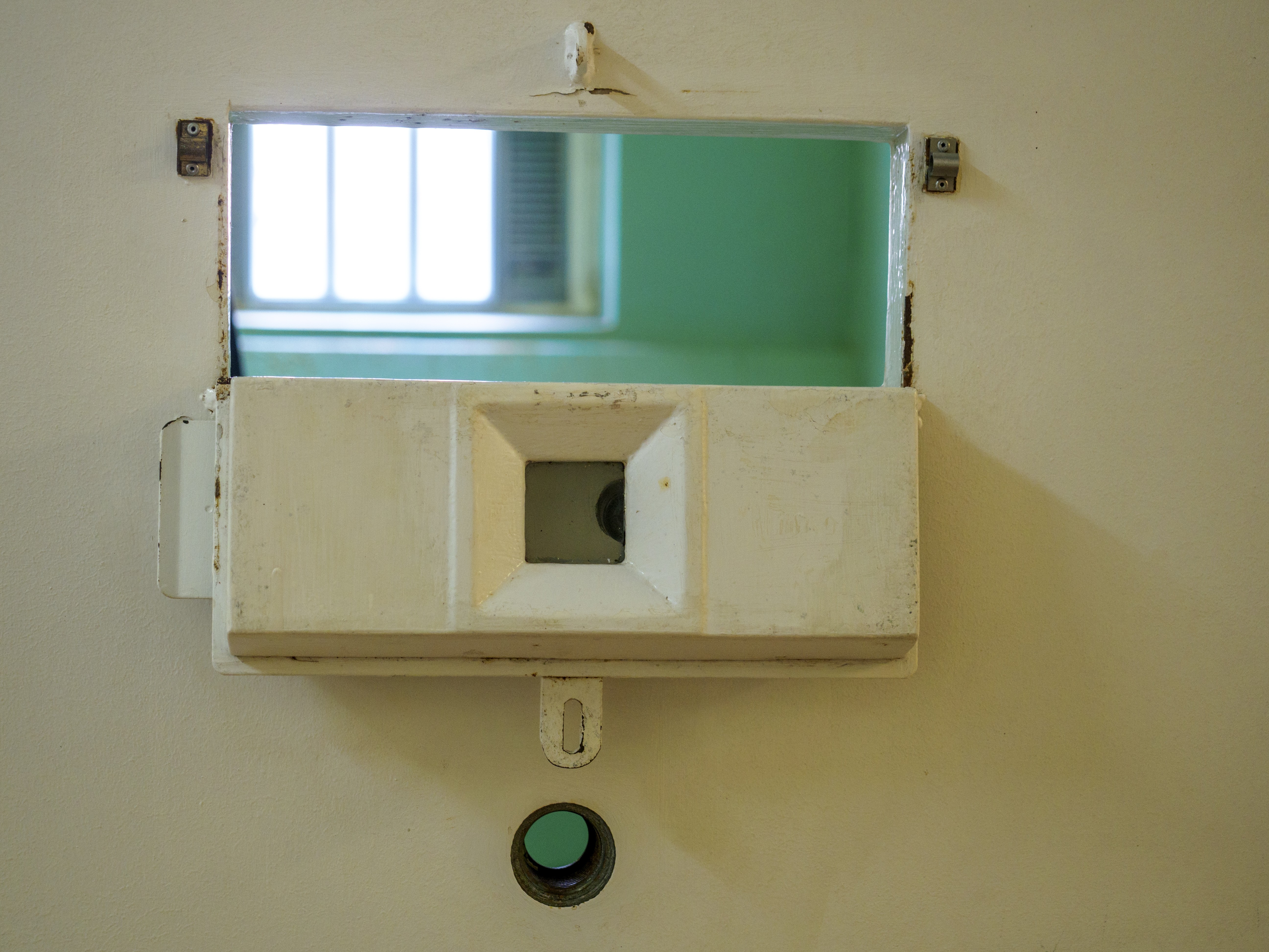 A peep hole on a prison cell door. 