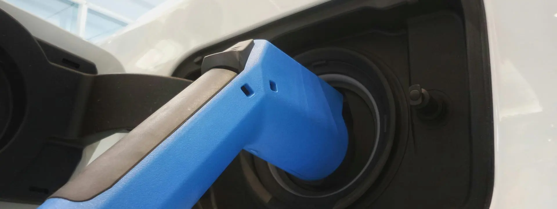 An electric vehicle being charged. Photo by Possessed Photography on Unsplash.