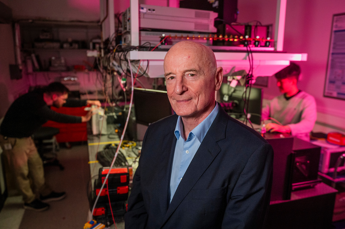 Image shows Professor Gerald Buller standing in a lab.