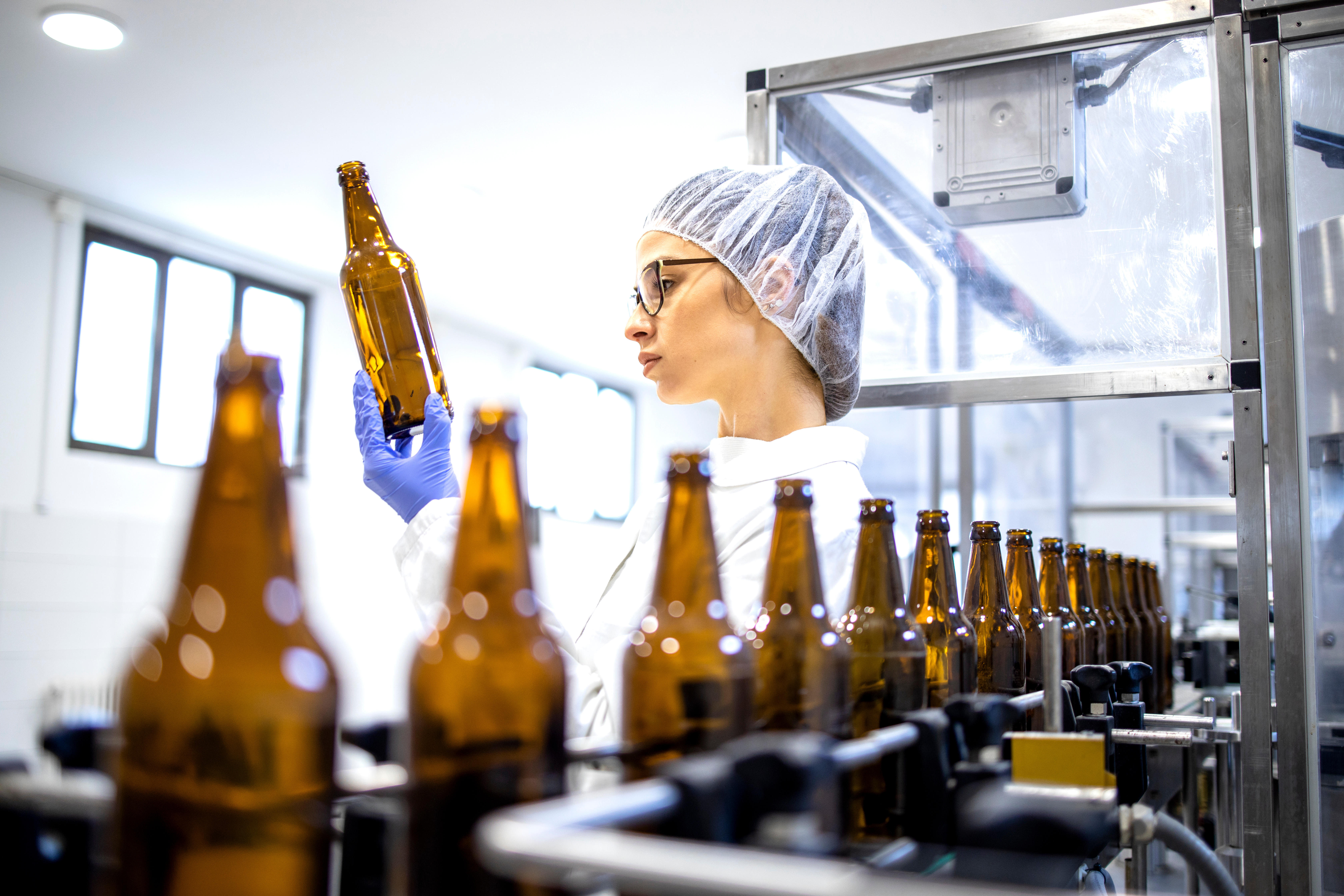 a person in a bottling lab