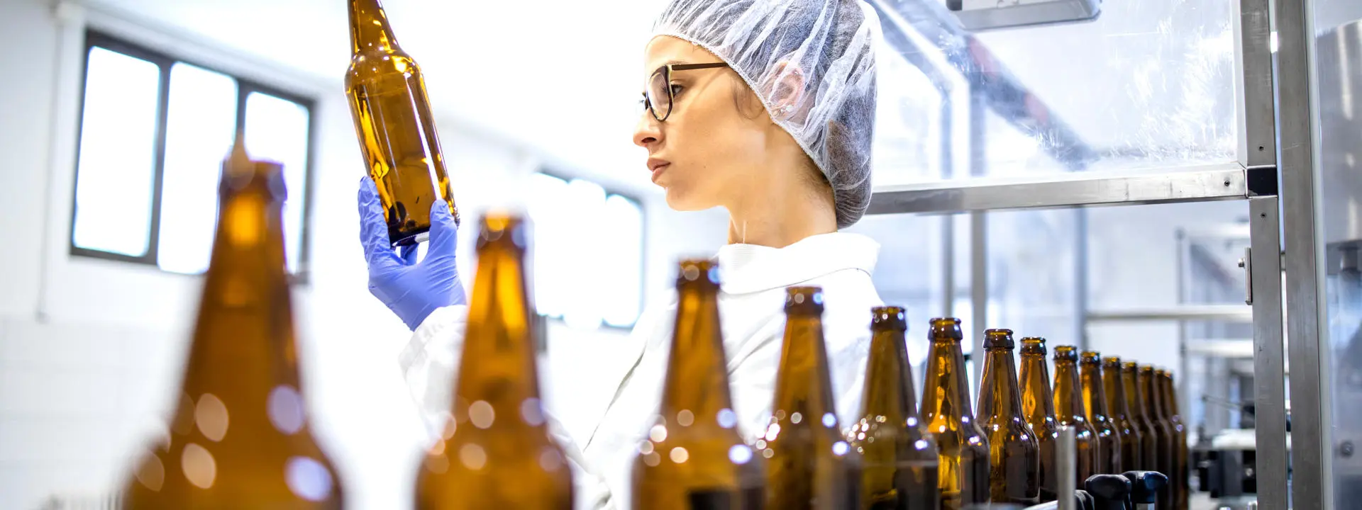 a person in a bottling lab