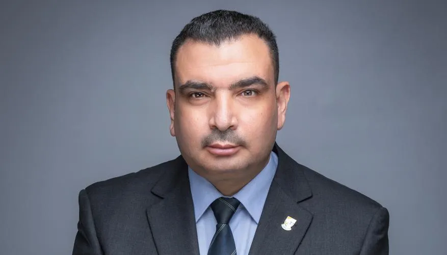 Professor Rabee Rustum, School of Energy, Geoscience, Infrastructure and Society Professor Rabee Rustum in a grey suit with a light blue shirt and dark blue tie.