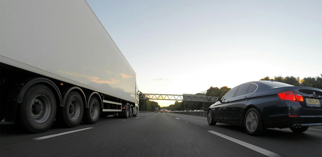 A truck and car on a motorway. Photo by Mike Bird, Pexels. A truck and car on a motorway. Photo by Mike Bird, Pexels.