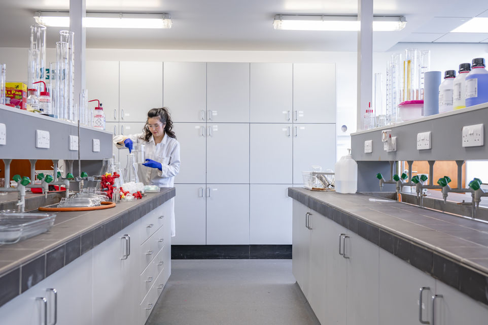 Neurodivergent women are often experts at ‘masking’ their neurodivergent traits to fit into workplaces. A scientist at work in a lab.
