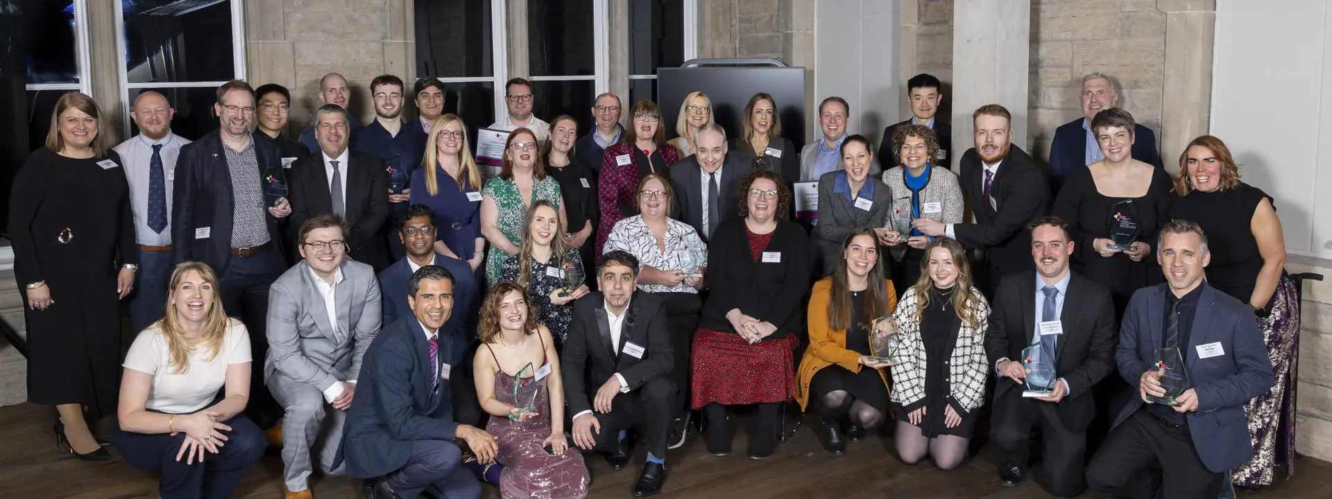 A group of people accepting awards