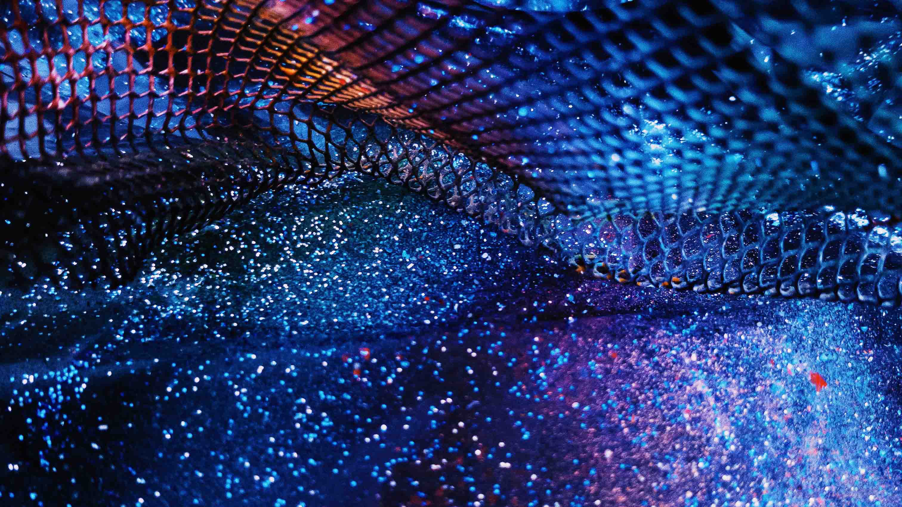 A starry blue and purple mesh, blending colours to form a celestial design.