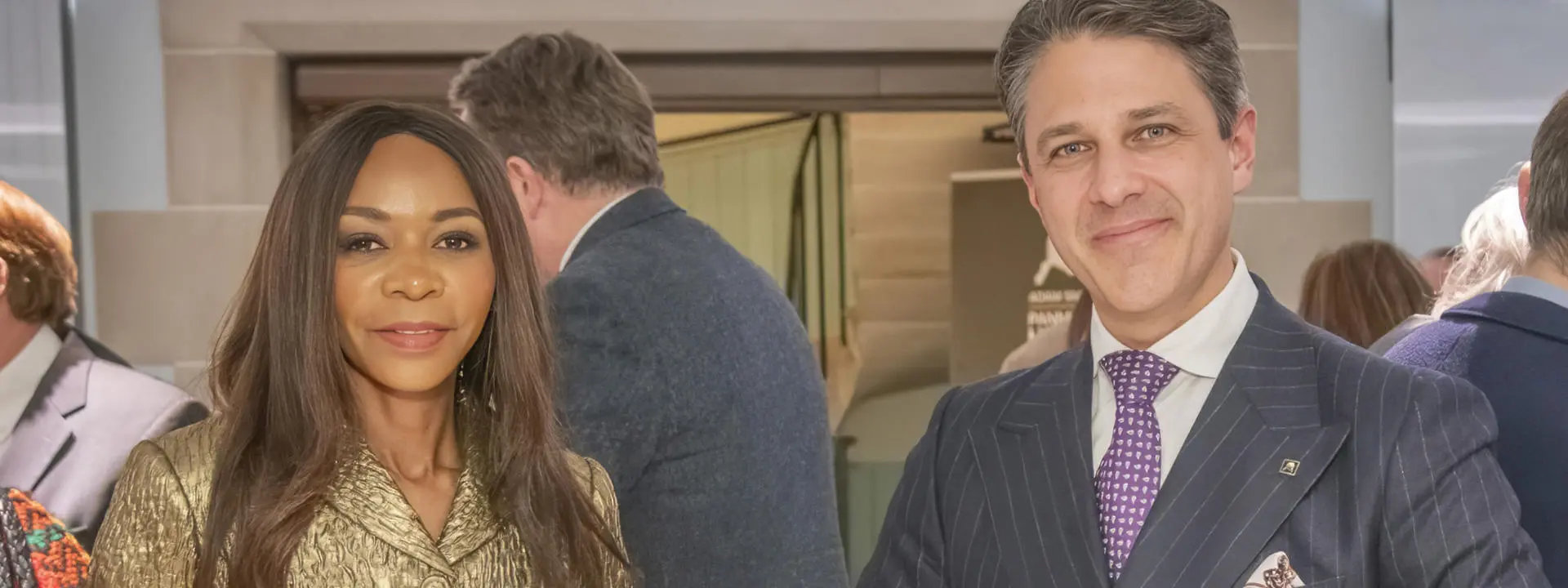 The Right Honourable The Baroness Moyo of Knightsbridge and Prof Adam Dixon standing beside each other with the Wealth Of Nations