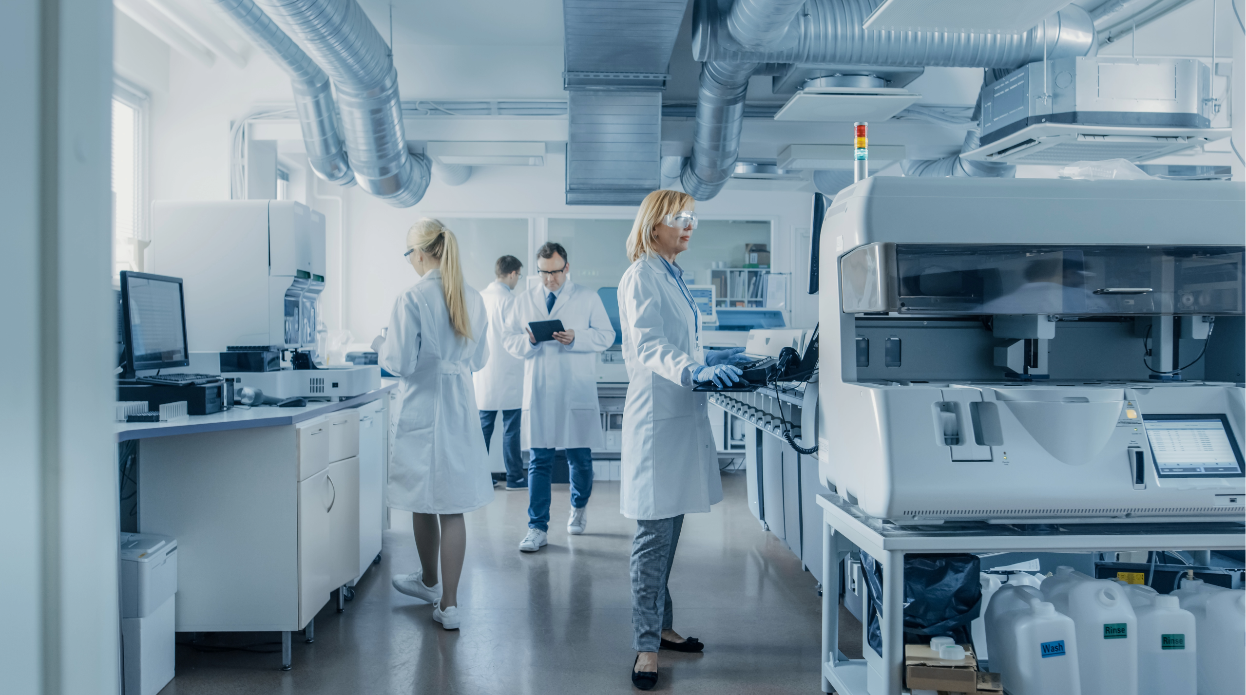 People working in a lab creating medical devices 