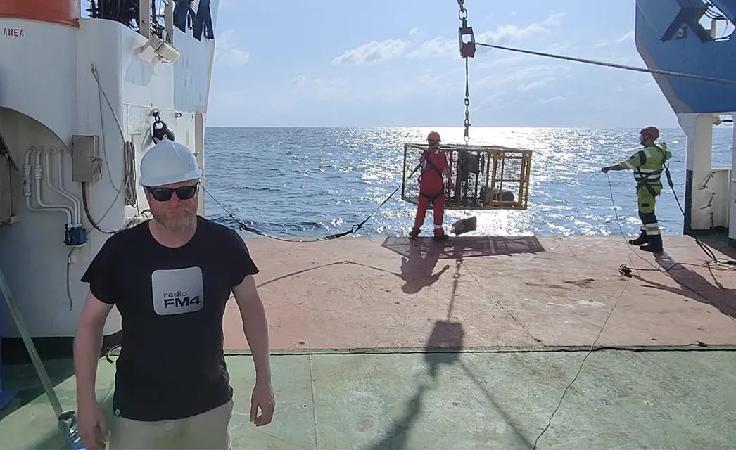 Dr Mark Hartl and crew preparing equipment on the research vessel RSS James Cook. Dr Mark Hartl and crew preparing equipment on the research vessel RSS James Cook.