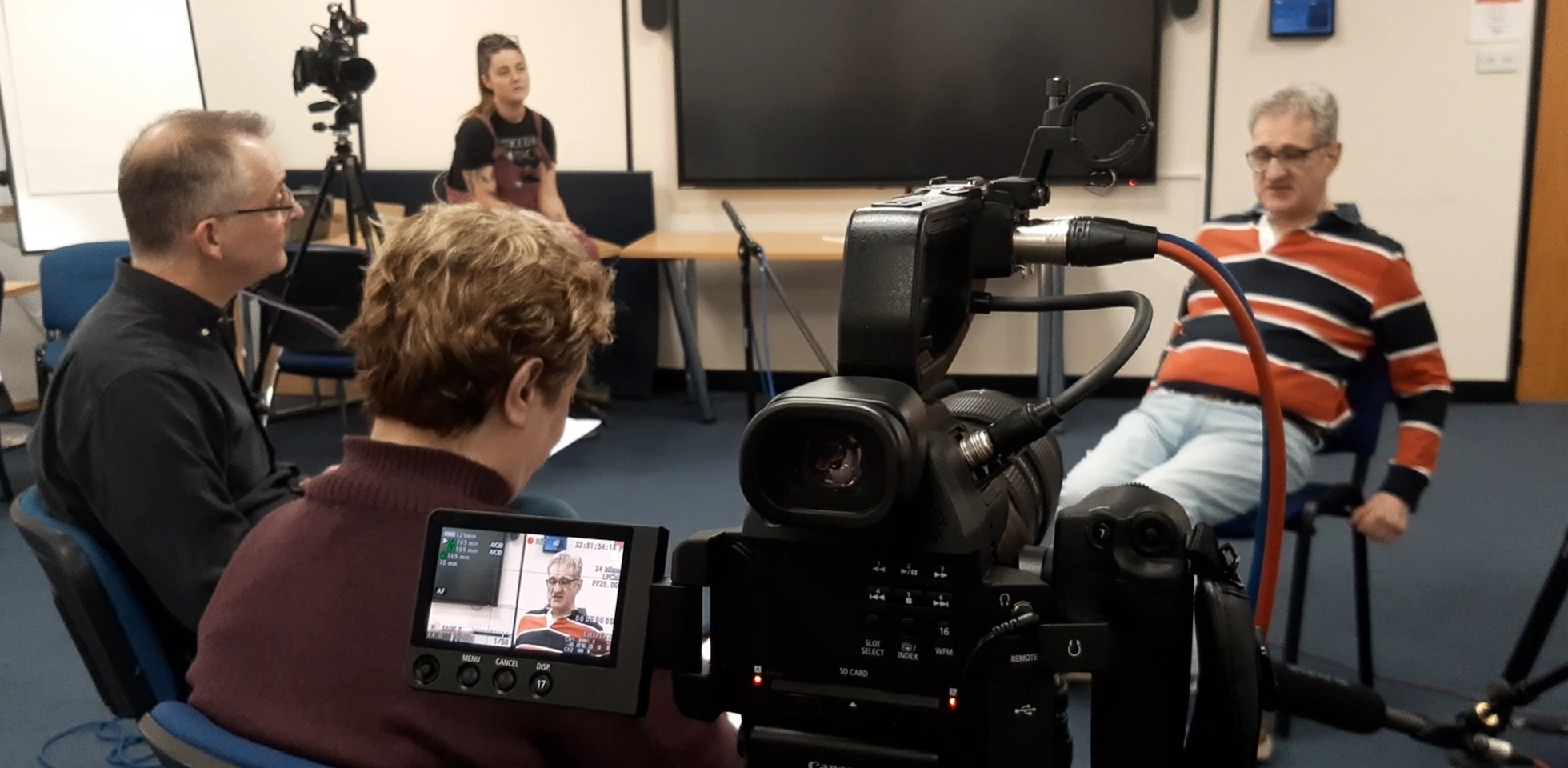 Dr Joe Long pictured with autistic researcher Emma Stanley and interviewee project participant Christopher Marley.