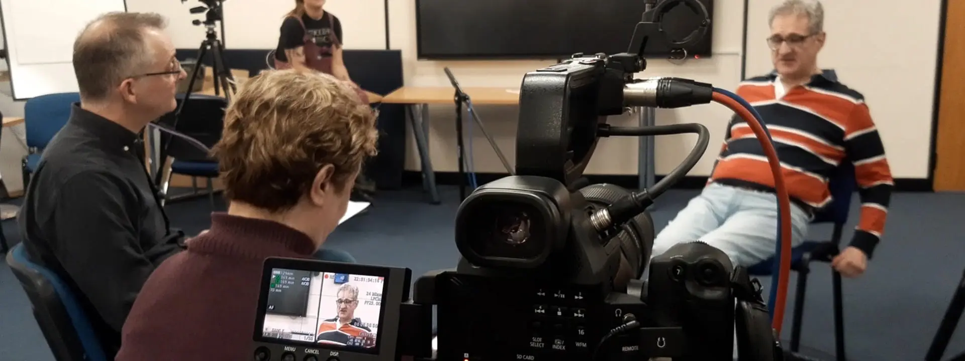 Dr Joe Long pictured with autistic researcher Emma Stanley and interviewee project participant Christopher Marley.