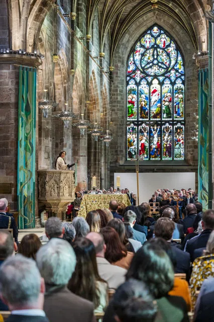 Speaker addresses the large crowd within the Cathedral.