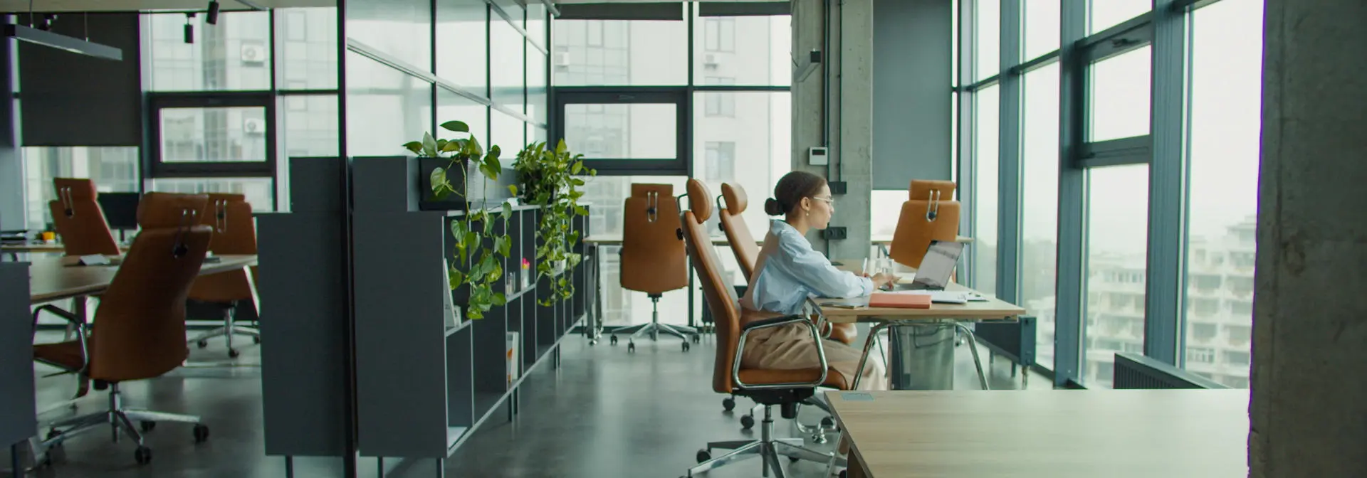 Woman sitting at a desk in an office.