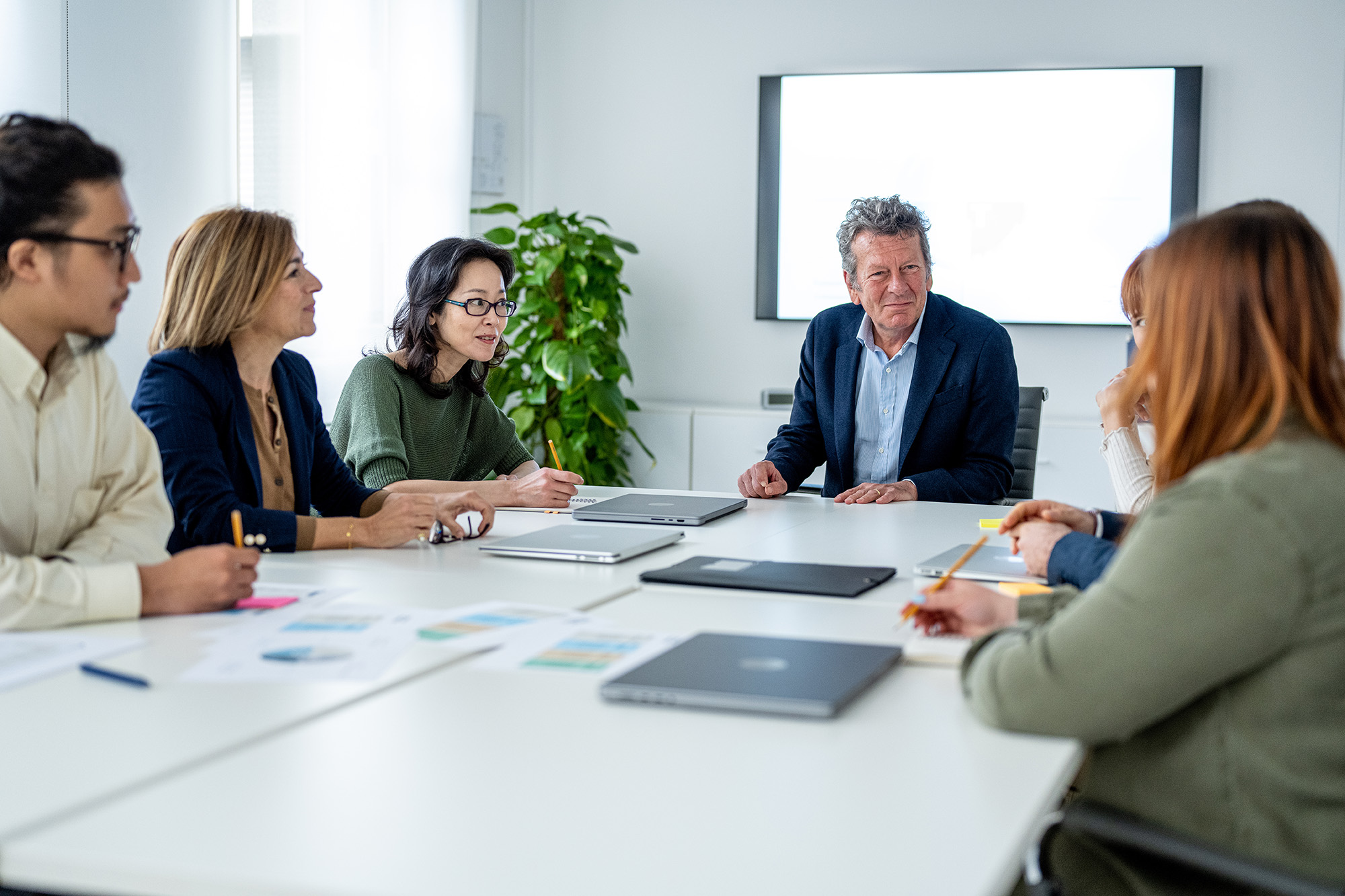 Business meeting in an office for five people