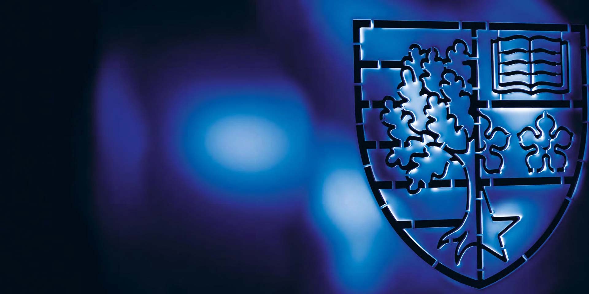 The Heriot-Watt shield on a blue background