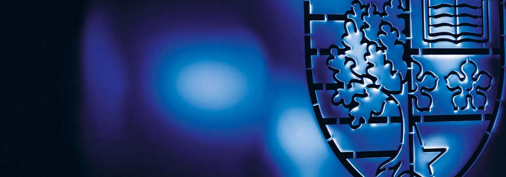 The Heriot-Watt shield on a blue background