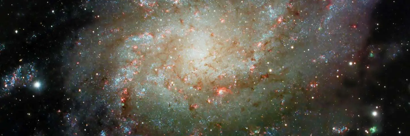 A spiral galaxy, highlighting its elegant structure and luminous center amidst the vast cosmos.