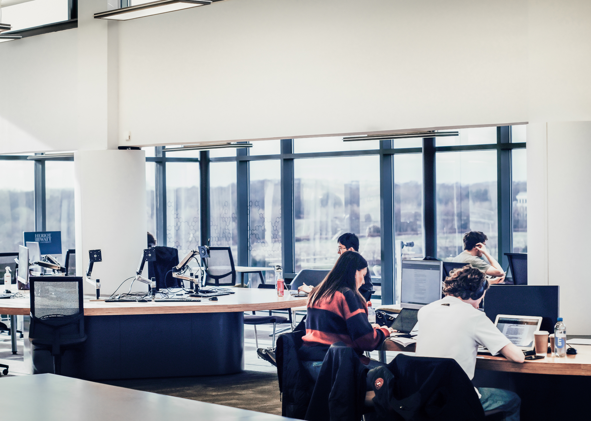 Students working on computers in a common area