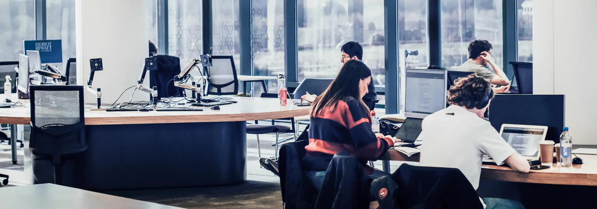 Students working on computers in a common area