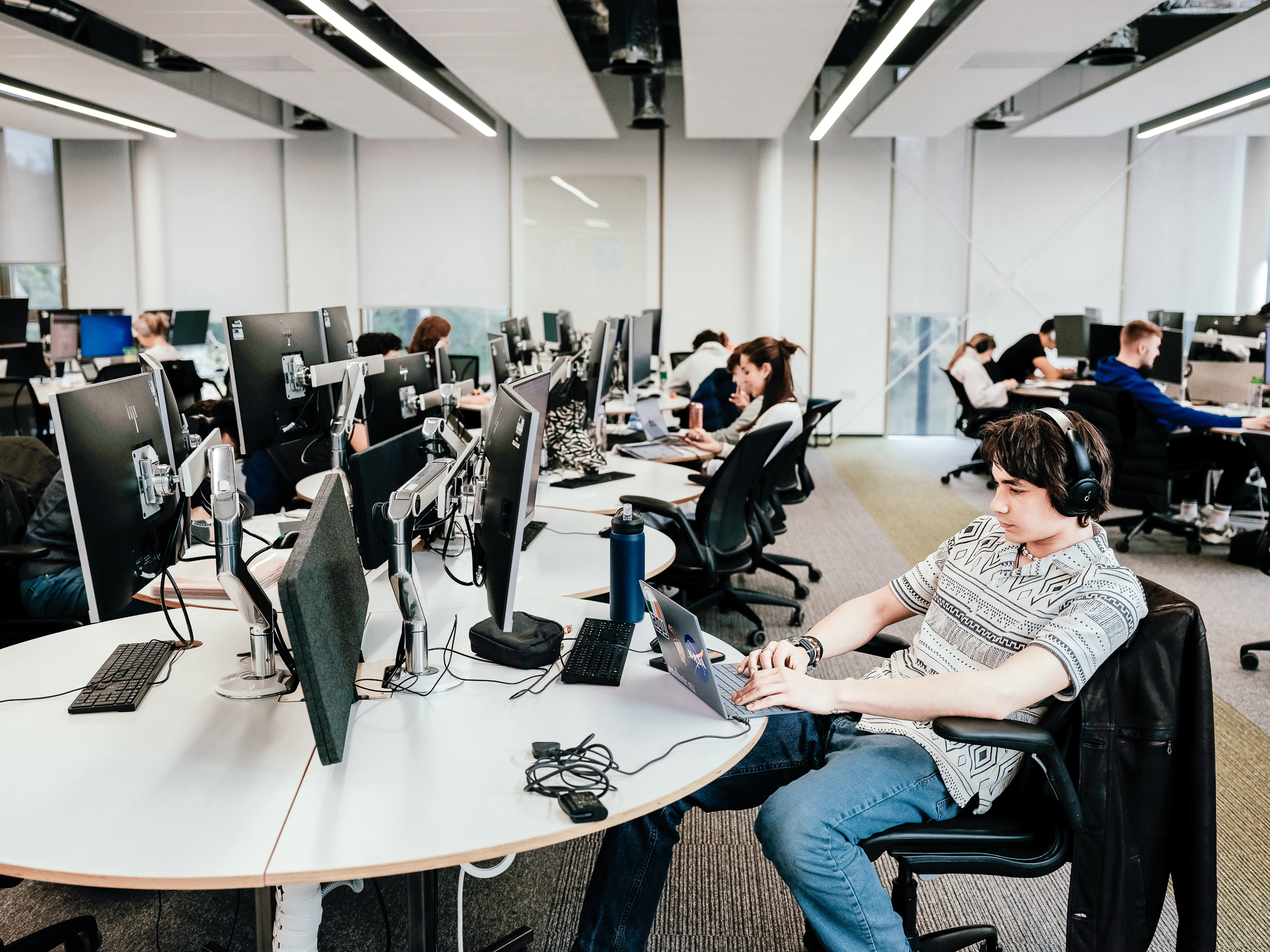 Students working on computers in a common area  