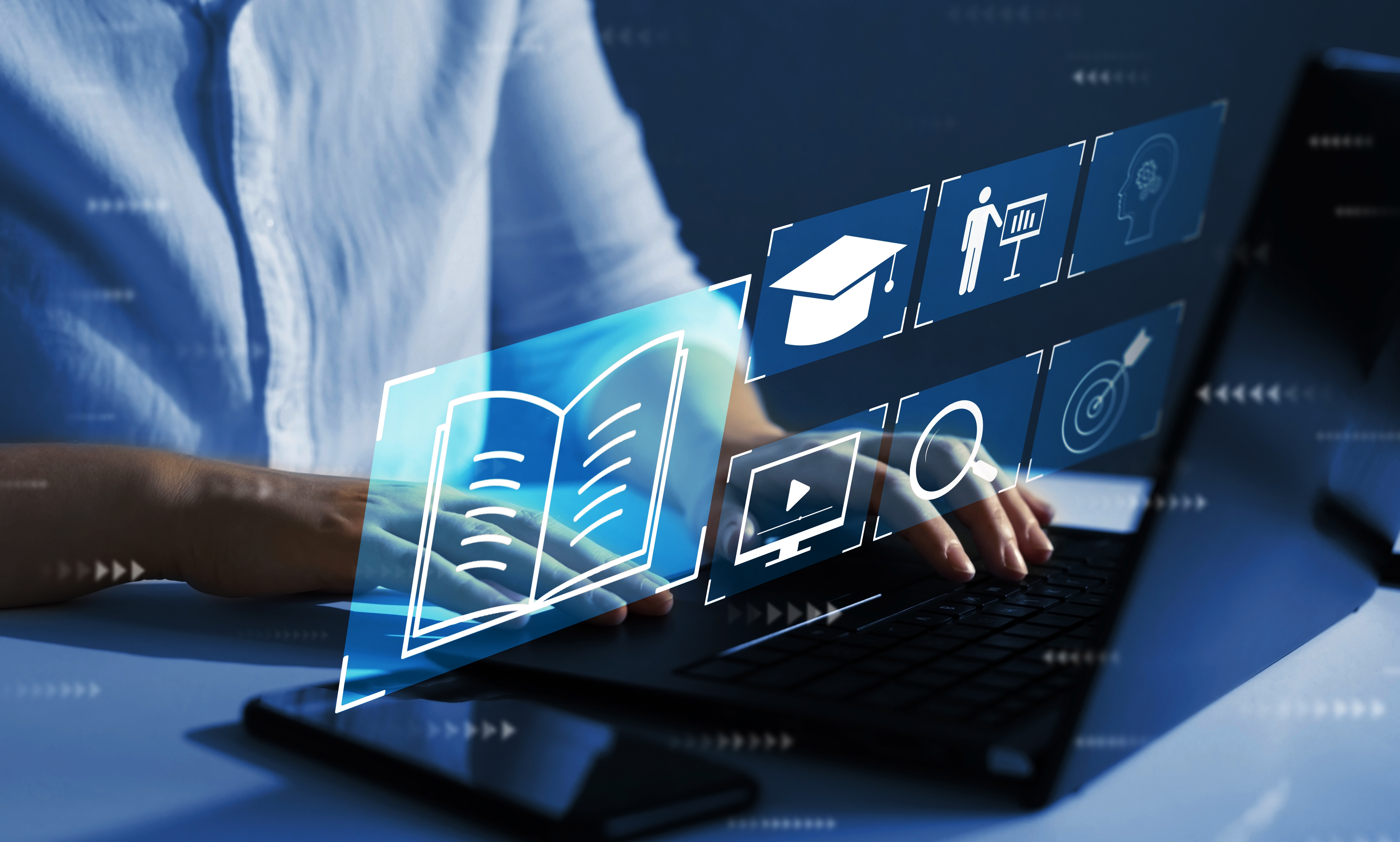  A person types on a laptop keyboard, with floating digital icons.