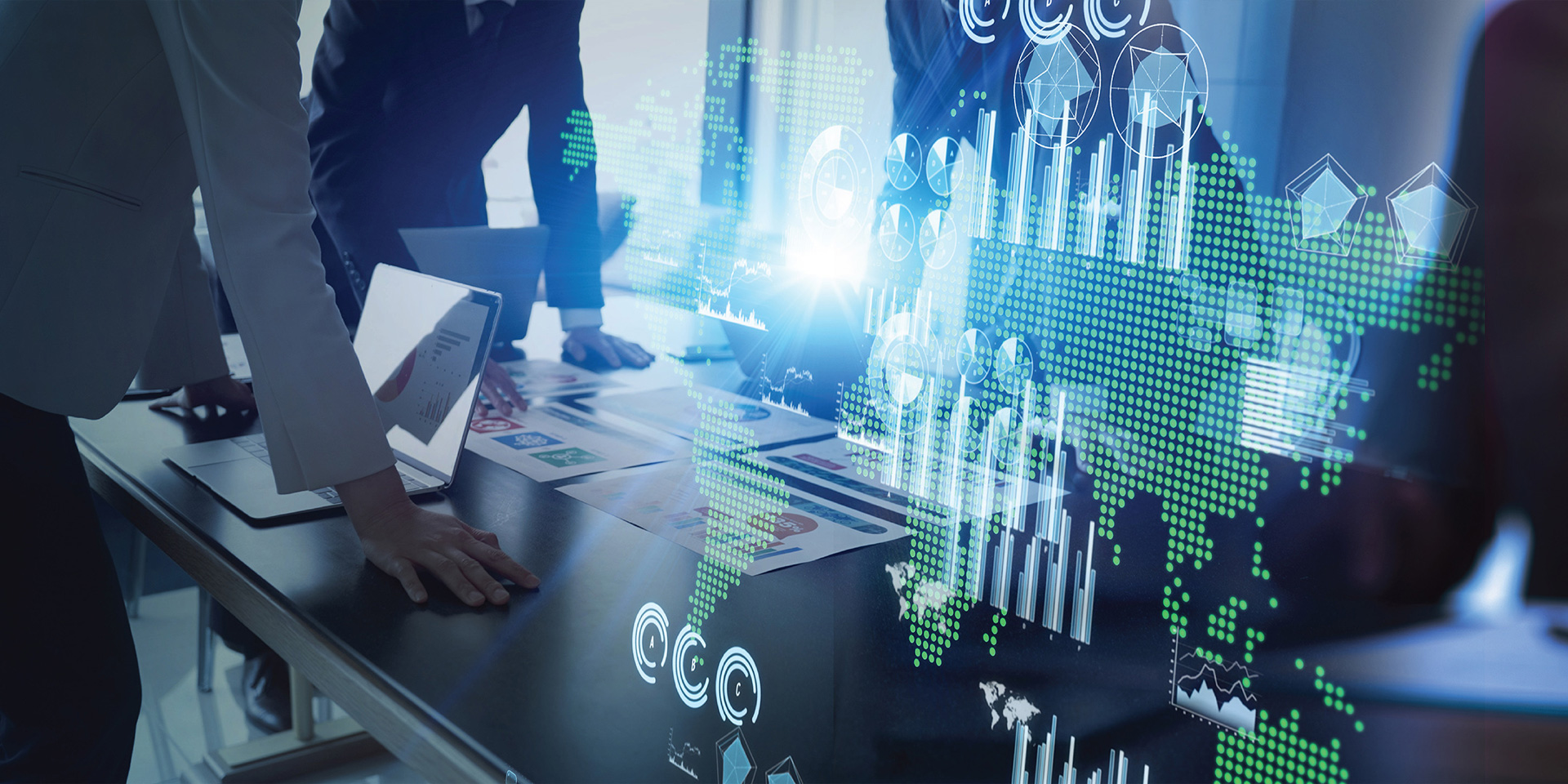 Team of business people engaged with a laptop, reviewing graphs and data to enhance project outcomes.