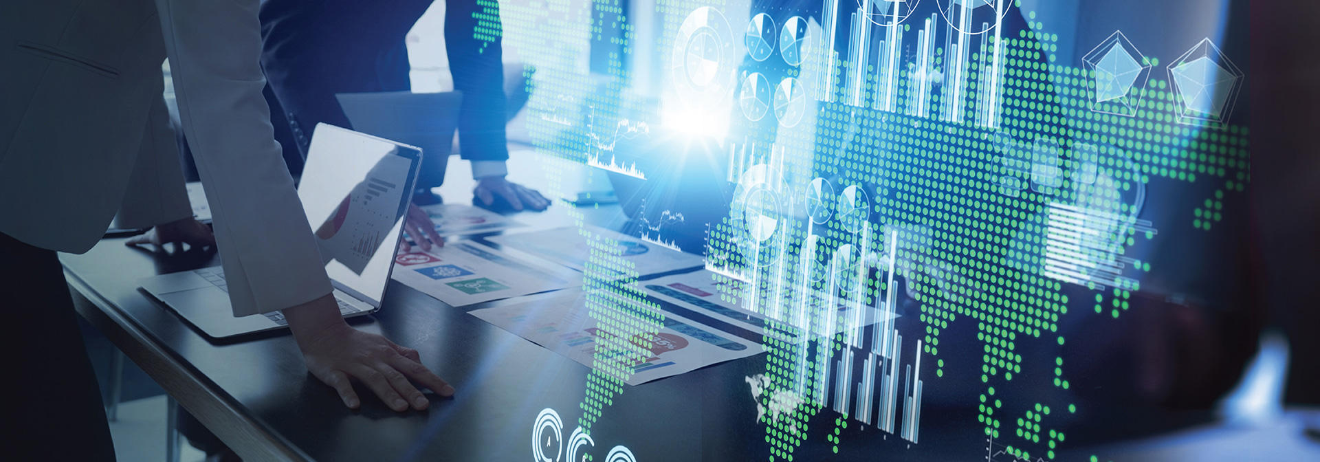 Team of business people engaged with a laptop, reviewing graphs and data to enhance project outcomes.