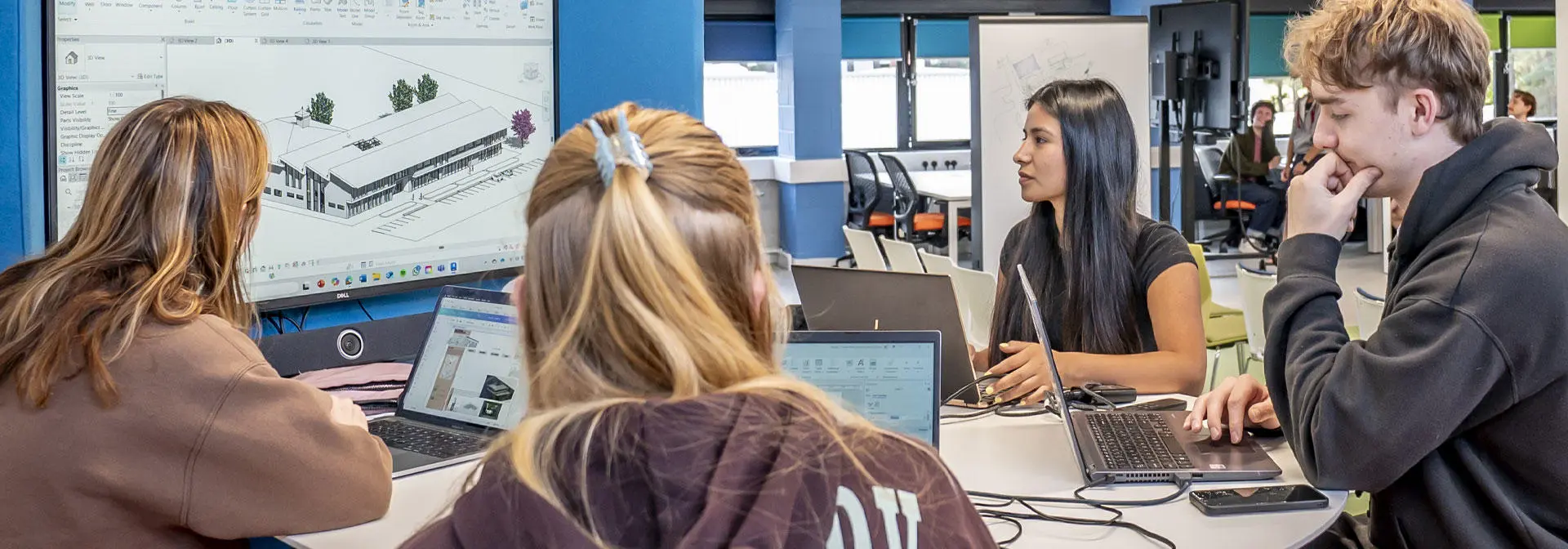 Students collaborate on a design project in the studio.