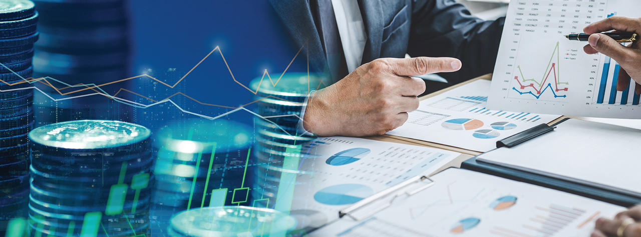 A group of business people reviewing charts and coins, discussing financial strategies.