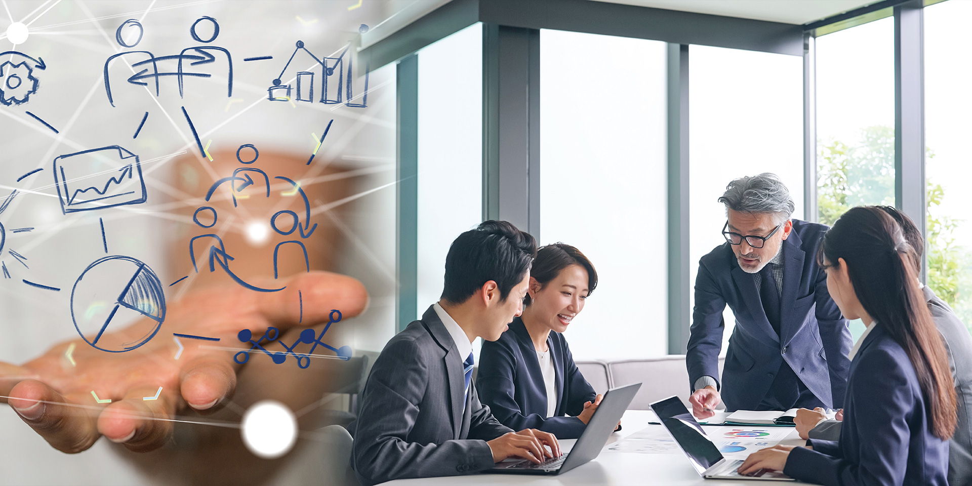 A diverse group of business professionals engaged in discussion around a conference table in a meeting room.