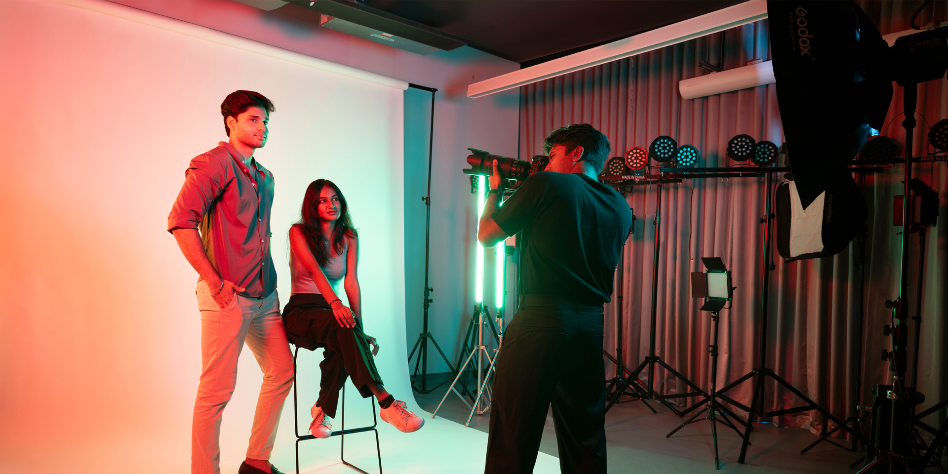 Design Management students model in the photography studio.