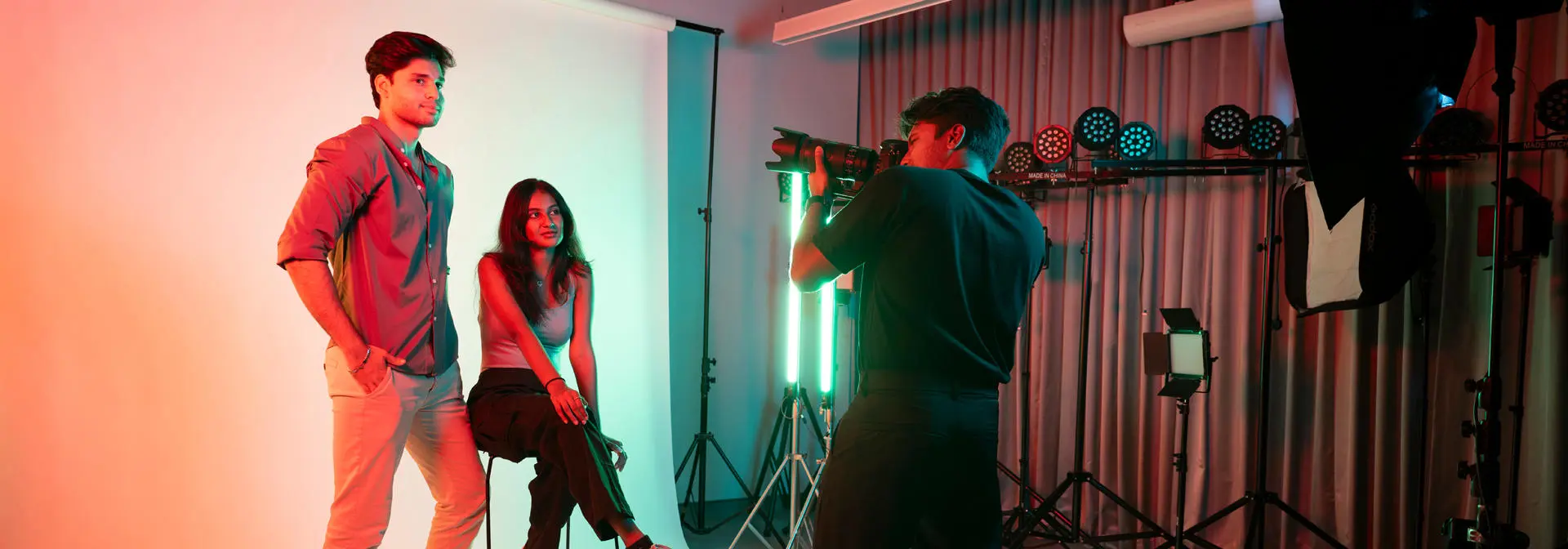 Design Management students model in the photography studio.