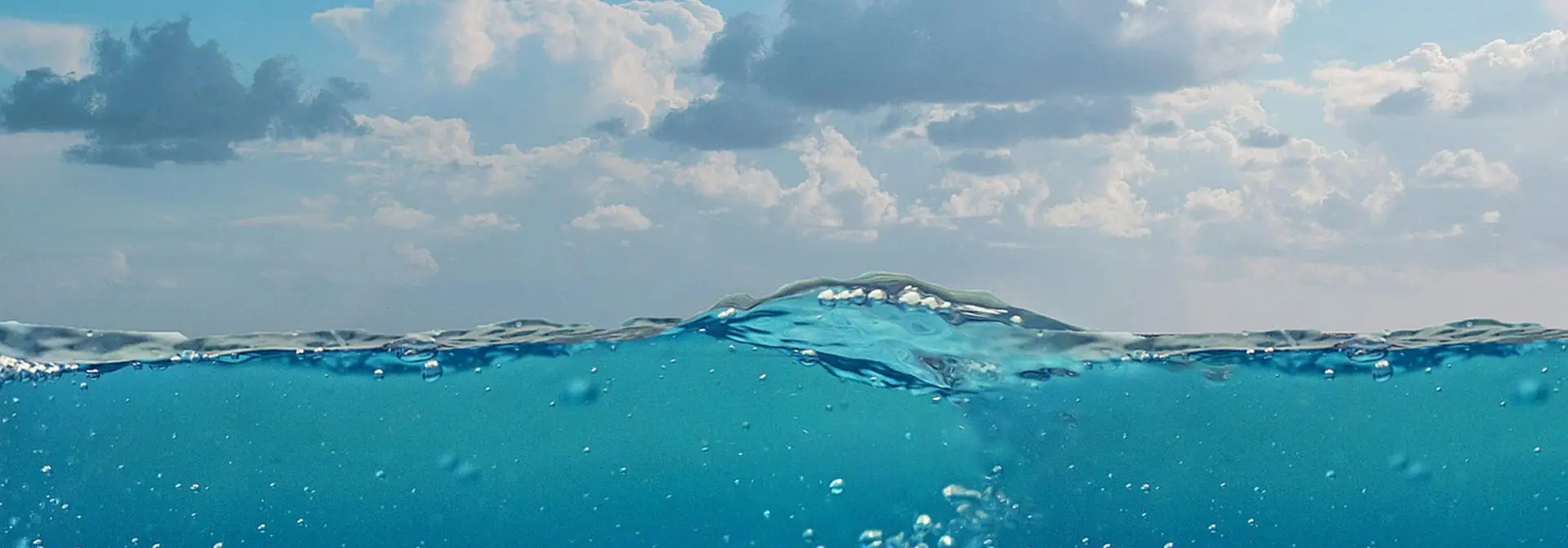sea surface and cloudy sky.