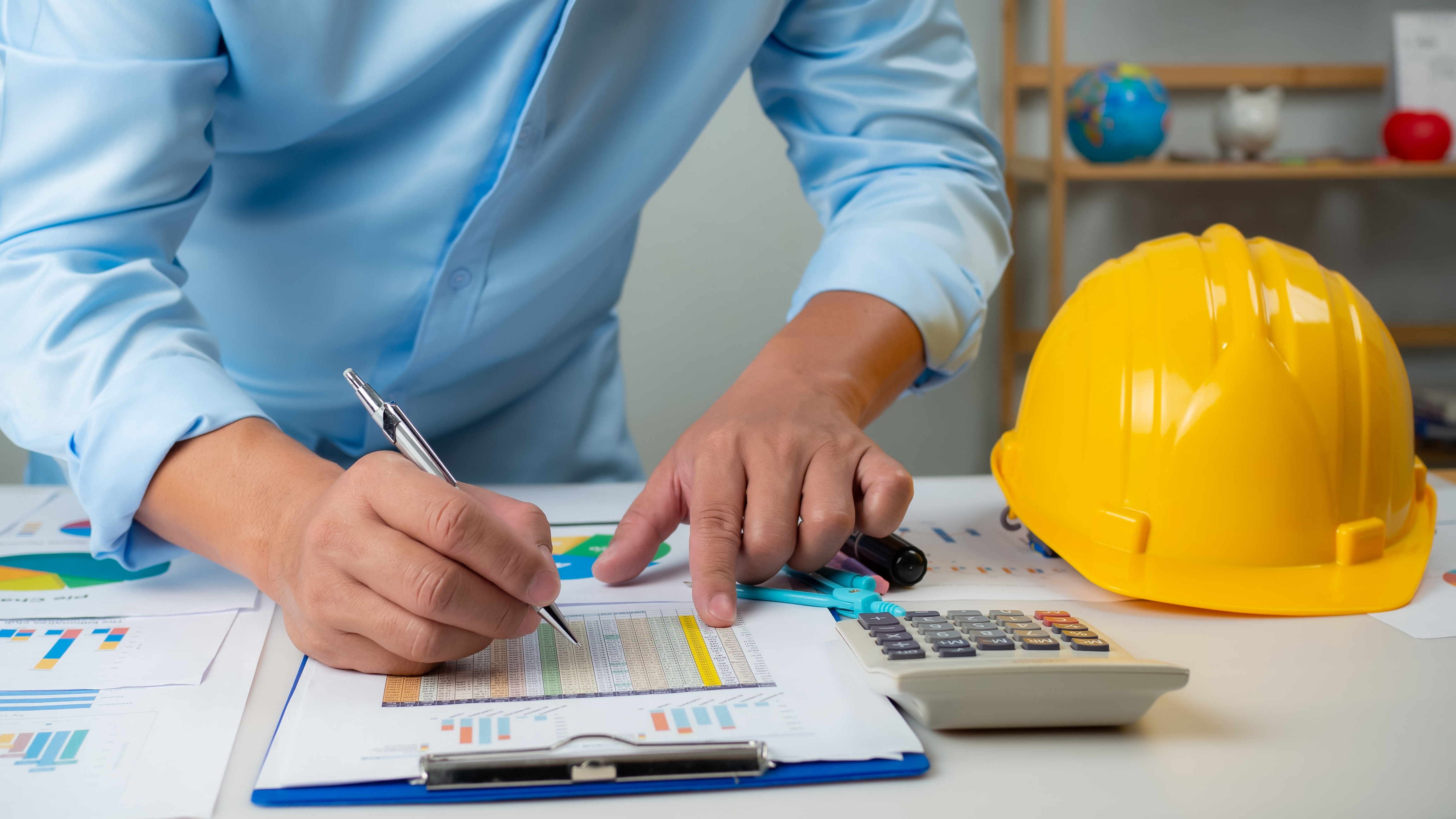 engineer looking at data on a paper