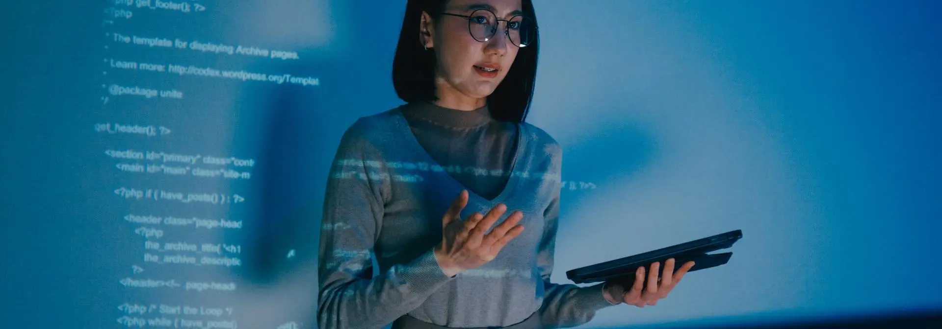 Student presenting their code infront of a projection