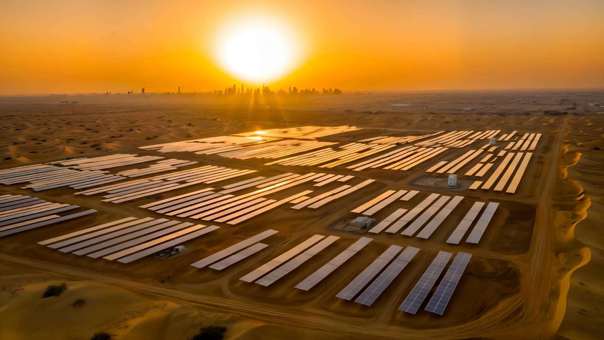 rows of solar panels in the middle of the desert
