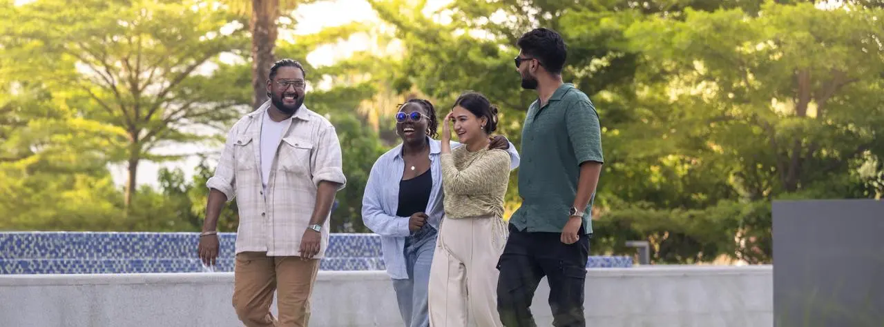 Students in Dubai walking outside on campus