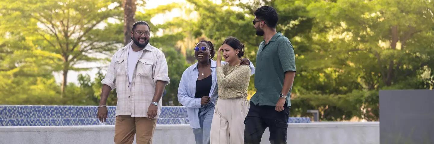 Students in Dubai walking outside on campus