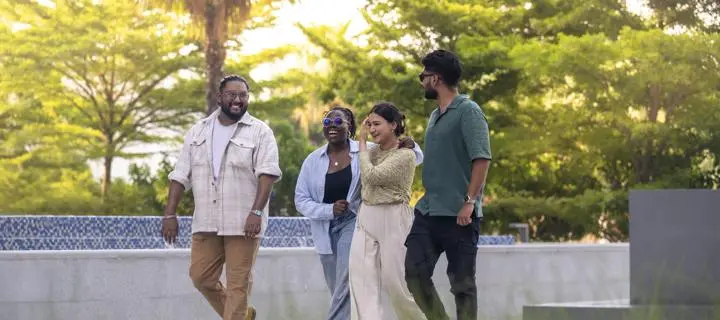 Students in Dubai walking outside on campus