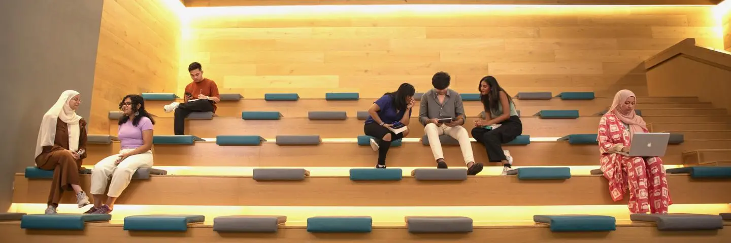 Students on Dubai campus studying and socialising