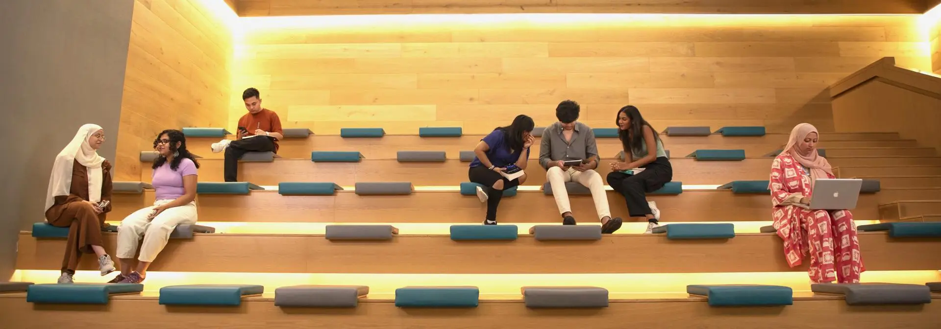 Students on Dubai campus studying and socialising