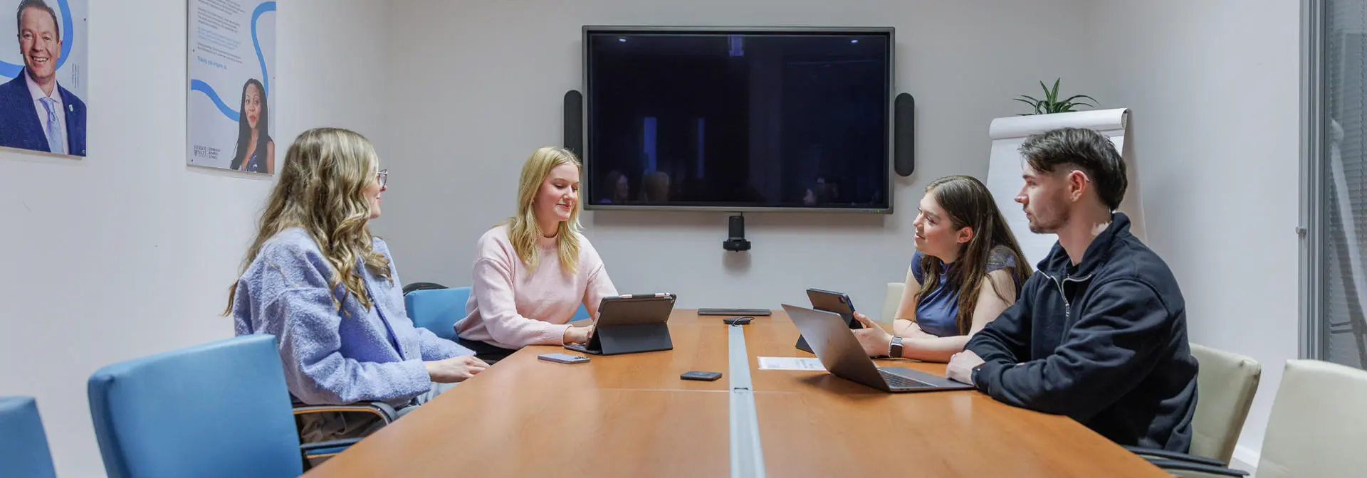 Students working together in a meeting room